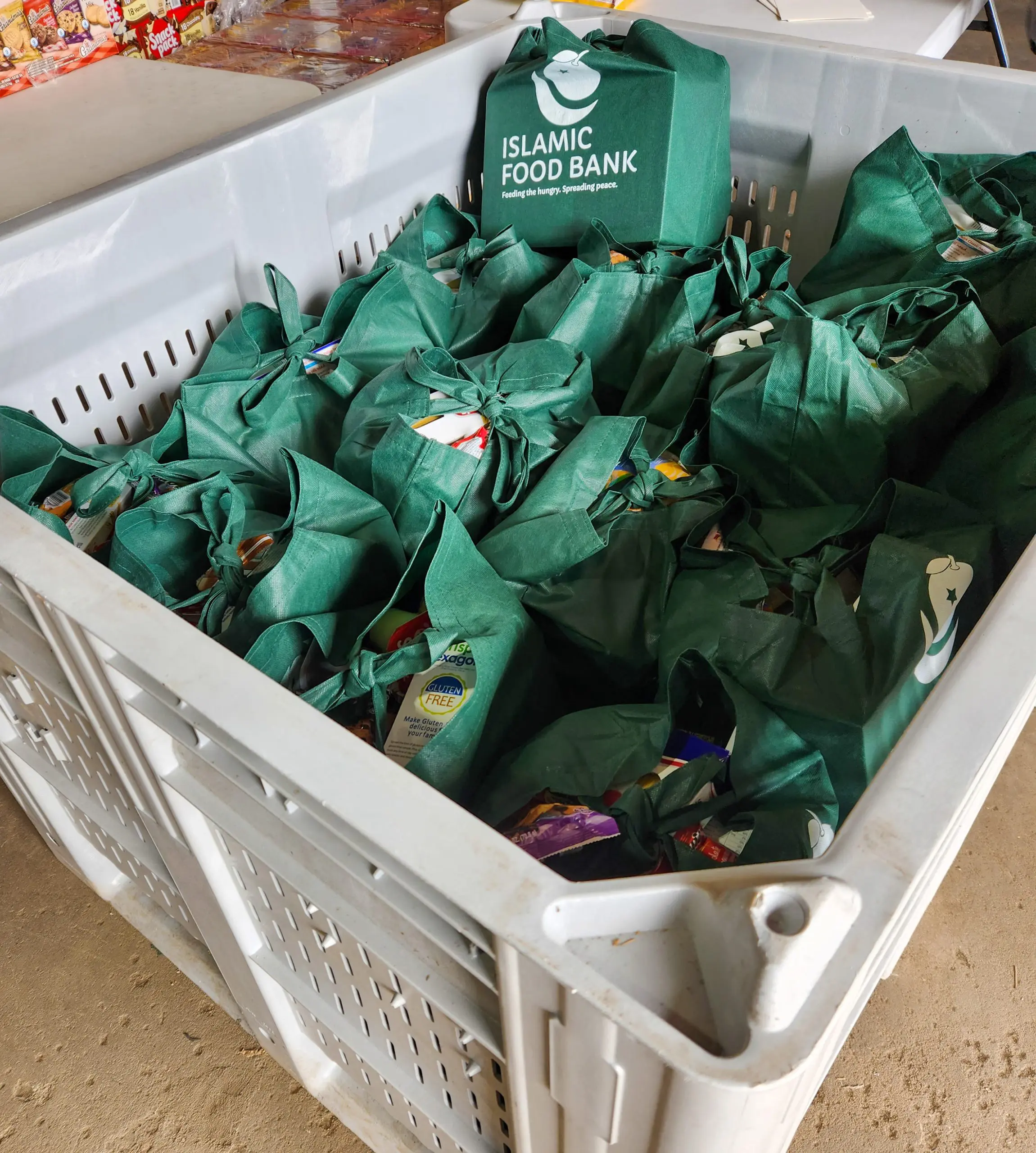 A box full Islamic Food Bank bags of food